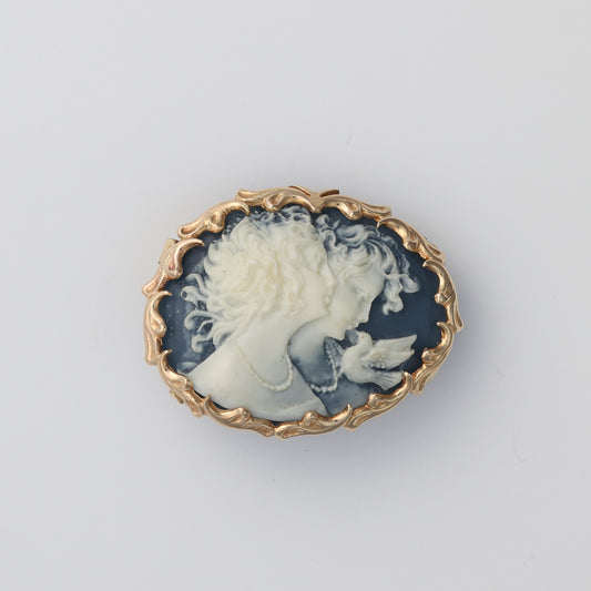 Blue Agate Carved cameo pin with a 14k yellow gold stylized bezel setting.